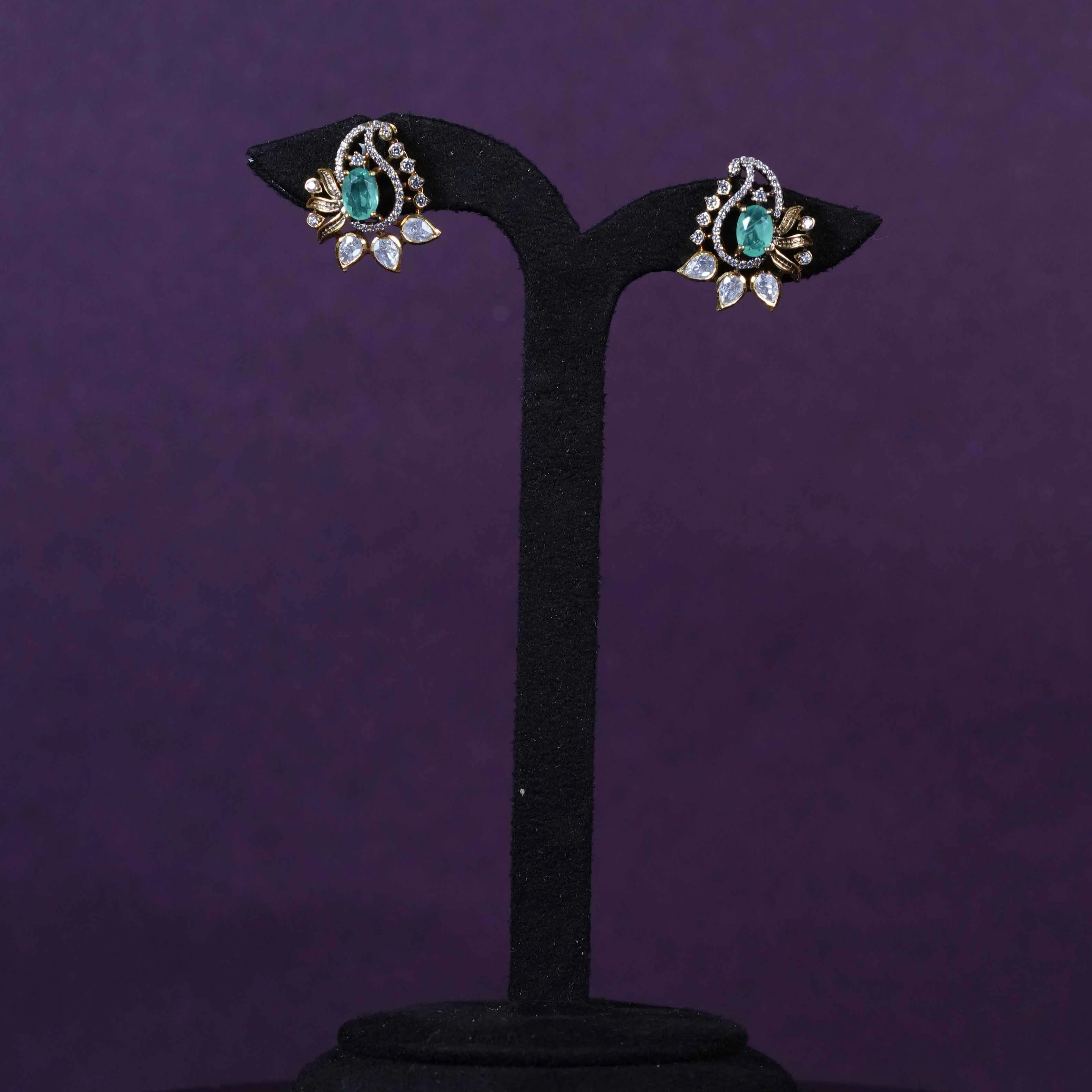 Emerald American Diamond Swirl Statement Stud Earrings
